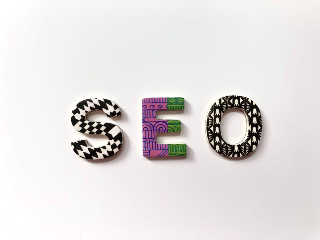 Colorful letters spelling out SEO on a plain white background