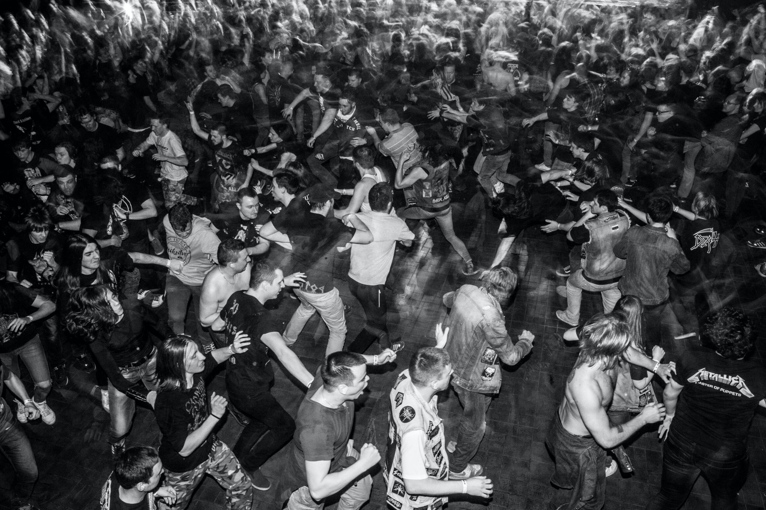 A black and white photo of a mosh pit that's representative of the modern buyer's journey